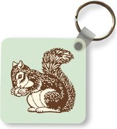Sleutelhanger - Uitdeelcadeautjes - Een illustratie van een eekhoorn met een eikel - Plastic