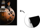 Behang - Fotobehang Een houten elektrische gitaar - Breedte 150 cm x hoogte 220 cm