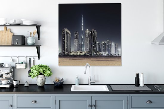 Canvas schilderij 90x90 cm - Wanddecoratie De Burj Khalifa verlicht met andere wolkenkrabbers de lucht boven Dubai - Muurdecoratie woonkamer - Slaapkamer decoratie - Kamer accessoires - Schilderijen op canvas