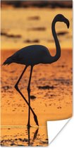 Poster Het silhouet van een flamingo bij zonsondergang - 60x120 cm