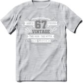 67 Jaar Legend T-Shirt | Zilver - Wit | Grappig Verjaardag en Feest Cadeau | Dames - Heren - Unisex | Kleding Kado | - Licht Grijs - Gemaleerd - L