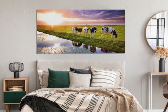 Tableau sur toile Vaches pendant un coucher de soleil - 160x80 cm - Décoration murale Art