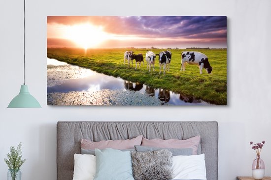 Tableau sur toile Vaches pendant un coucher de soleil - 160x80 cm - Décoration murale Art