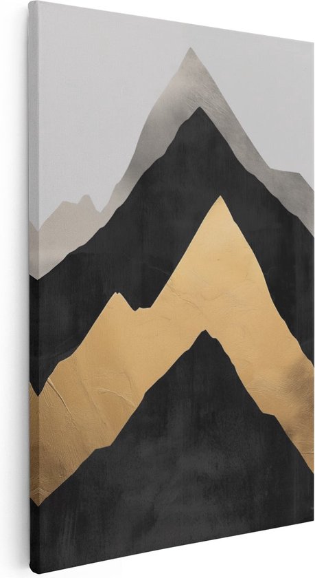 Canvas schilderij met zwarte, grijze en gouden bergtoppen, hangend aan een witte muur.