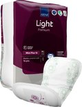 Abena Light Premium Mini Plus 1A verpakking met een wit verband met groene bloemendecoratie.