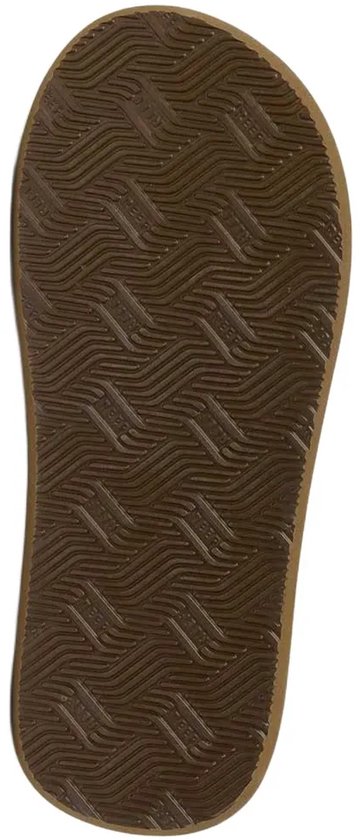 Onderkant van bruine Reef teenslipper met golvend profiel.