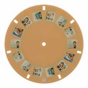 Een ronde schijf met afbeeldingen van dieren en kinderen, in oranje tinten. Het logo 'ld.' is zichtbaar.