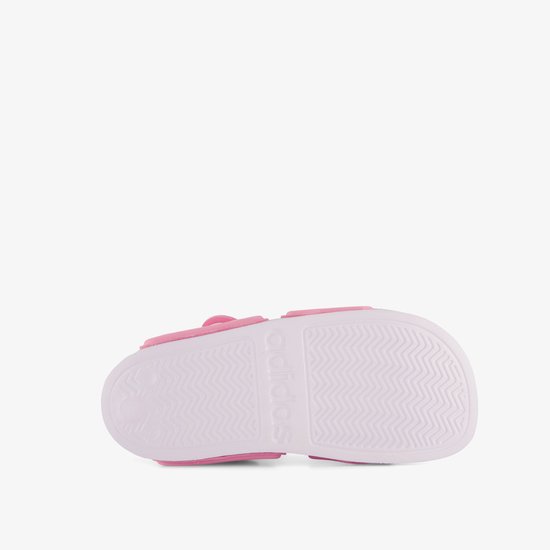 Roze sandalen met witte zool en Adidas logo in reliëf.