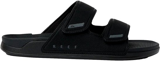 Zijkant van een zwarte Reef slipper met verstelbare bandjes.