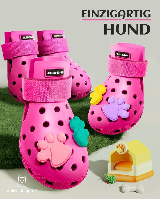 Roze hondenschoenen met klittenbandsluiting, versierd met gekleurde pootafdrukken.