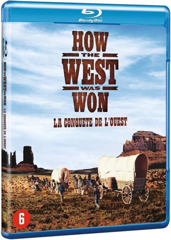 De Blu-ray hoes van "How the West Was Won" toont de filmtitel en een prairie met bedekte wagens, ossen en een bergenlandschap op de achtergrond.
