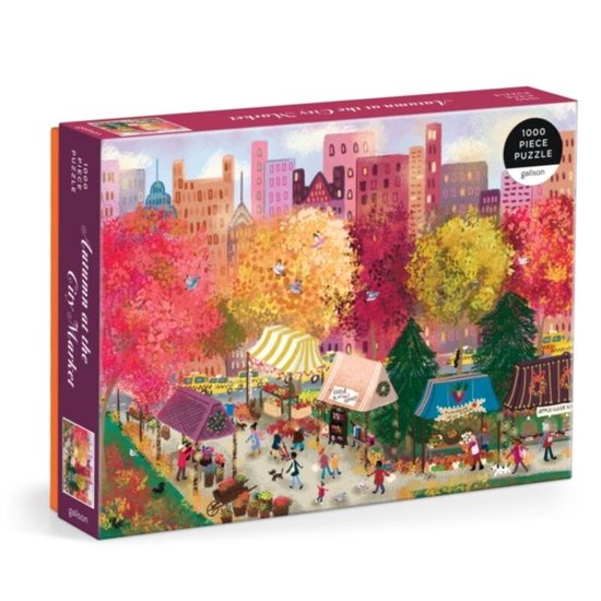 Doos van een 1000-delige puzzel, 'Autumn at the City Market', met een herfsttafereel van een drukke markt met bomen in felle herfstkleuren en gebouwen.