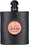 Zwarte flacon met glitterafwerking en rond koperkleurig etiket met 'BLACK OPIUM'.