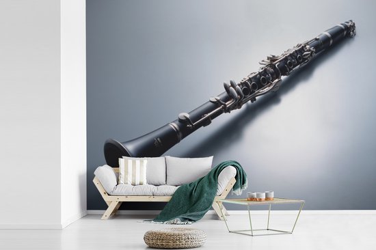 Papier peint Papier peint photo en vinyle - Une clarinette sur fond gris largeur 330 cm x hauteur 240 cm - Tirage photo sur papier peint (disponible en 7 tailles)