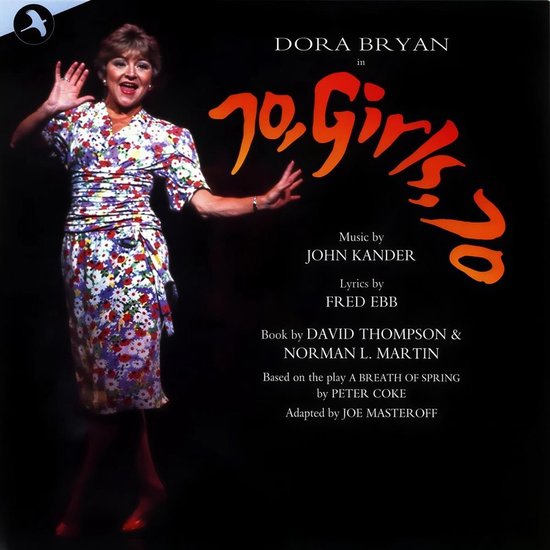 Dora Bryan in '70 Girls 70', met bloemenjurk en wijzend met haar handen.