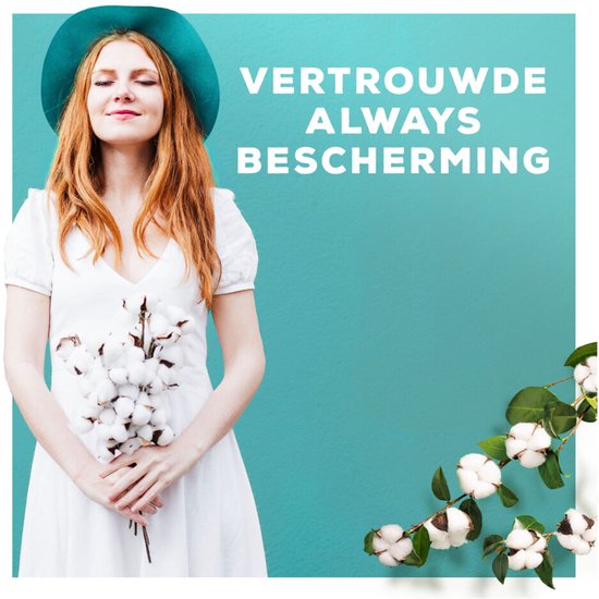 Vrouw met rode haren, blauwe hoed en witte jurk houdt katoen vast. Vertrouwde Always bescherming.