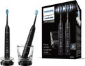 Zwarte Philips Sonicare 9000 DiamondClean tandenborstels op oplaadbasis, in glas en verpakking met 'For a whiter, healthier smile'.