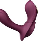 Gros plan d'un vibrateur violet à la forme incurvée.