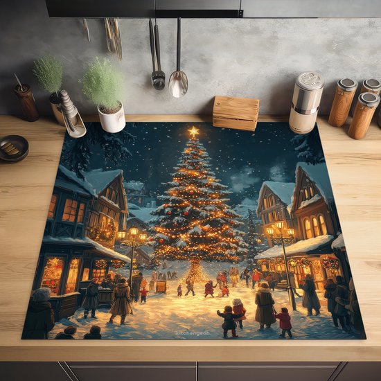Inductiebeschermer met kerstdorp-print op een houten keukenaanrecht.