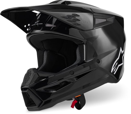 Zwarte crosshelm met vizier, ventilatie en Alpinestars logo.
