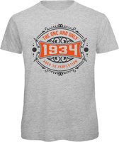1934 The One And Only | Feest Kado T-Shirt Heren - Dames | Antraciet - Oranje | Perfect Verjaardag Cadeau Shirt | Grappige Spreuken - Zinnen - Teksten | Maat M
