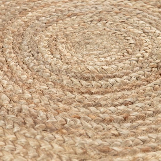 Close-up van de geweven structuur van een rond jute vloerkleed.