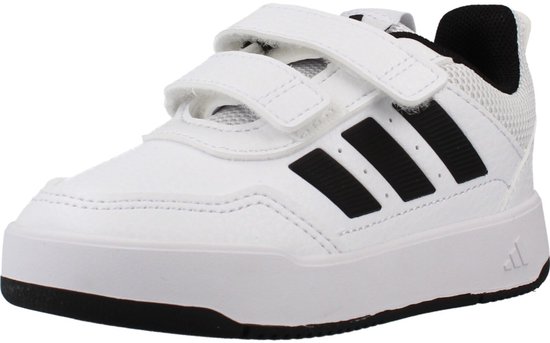Witte kindersneaker met klittenbandsluiting en zwarte Adidas strepen.