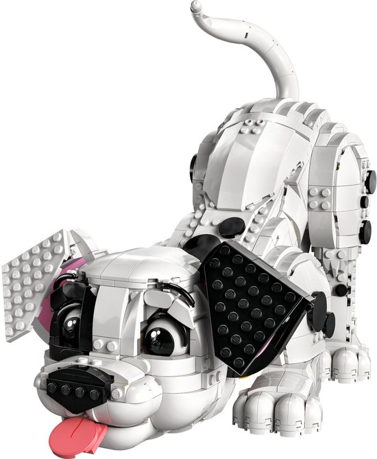 Un chiot dalmatien LEGO avec un pelage blanc, des taches noires et une langue rose qui dépasse de sa bouche.