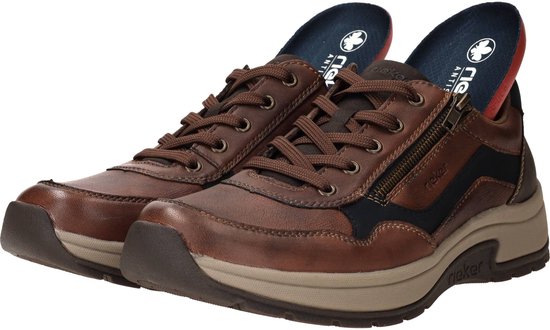 Bruine leren Rieker sneakers met rits en donkerblauwe accenten.
