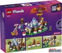 Achterkant van LEGO Friends 'Theekransje in het Bos' speelgoed 42690, met afbeeldingen van de set.