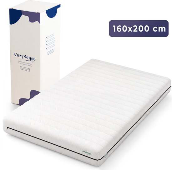 Wit CozySense matras van 160x200 cm naast de verpakking.