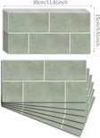 Twee gestapelde vellen met saliegroene zelfklevende muurstickers in metrotegelstijl, met afmetingen aangegeven.