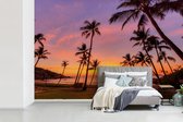 Behang - Fotobehang Palmen op een tropisch strand bij zonsopgang in Australië - Breedte 420 cm x hoogte 280 cm