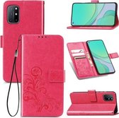 Voor OnePlus 8T vierbladige gesp reliëf gesp mobiele telefoon bescherming lederen tas met lanyard & kaartsleuf & portemonnee & beugel functie (magenta)