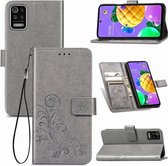 Voor LG K52 vierbladige gesp reliëf gesp mobiele telefoon bescherming lederen tas met lanyard & kaartsleuf & portemonnee & beugel functie (grijs)