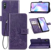 Voor Geschikt voor Xiaomi Redmi 9A Vierbladige sluiting Reliëfgesp Horizontale flip TPU + PU lederen tas met lanyard & kaartsleuf & portemonnee & houder (paars)