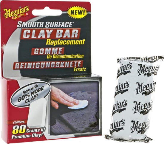 Meguiar's Smooth Surface Clay Bar Replacement met 80 gram premium klei. De verpakking toont een hand die over een natte auto wrijft met een witte kleistuk.