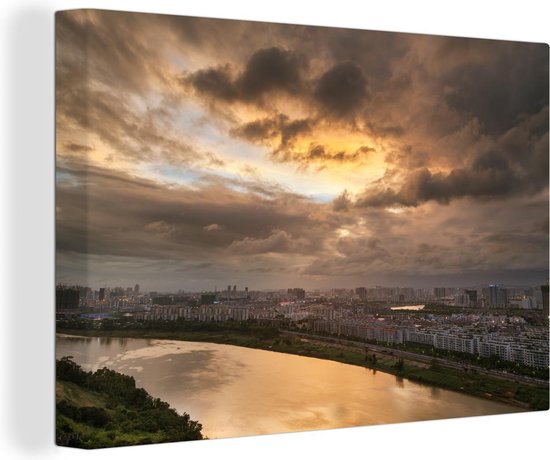 Canvas schilderij 140x90 cm - Wanddecoratie Kleurrijke wolkenformatie boven Nanning in China - Muurdecoratie woonkamer - Slaapkamer decoratie - Kamer accessoires - Schilderijen