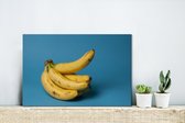 Canvas Schilderij Banaan - Fruit - Blauw - 30x20 cm - Wanddecoratie