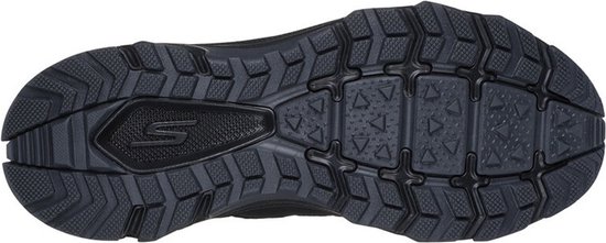 Zool van een paarse wandelschoen voor dames, met profiel en Skechers 'S' logo.