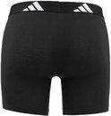 Zijzicht van zwarte Adidas boxer briefs met witte Adidas logo's op de zwarte tailleband.