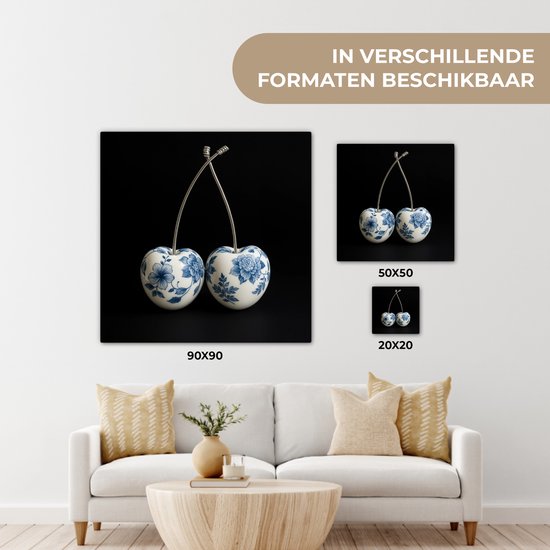 Vergelijking van verschillende formaten Delfts blauwe kersendecoratie op canvas.