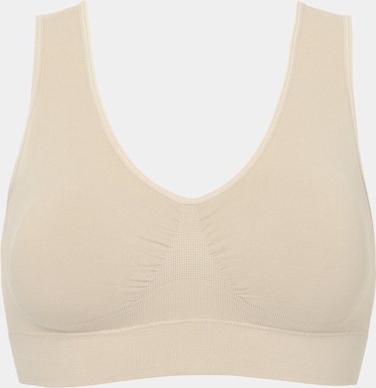 Crème kleurige, naadloze beha met V-hals en brede bandjes. Gerimpeld detail op de borst.