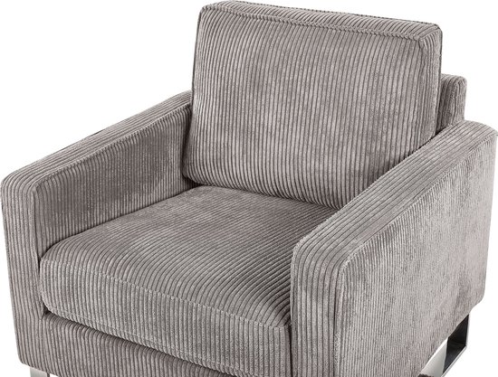 Grijze corduroy fauteuil met dikke, verticale ribbels en chromen poten.