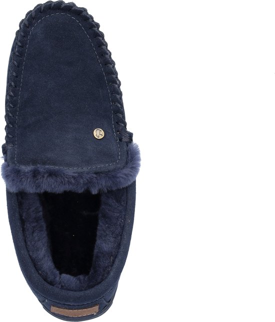 Donkerblauwe suède sloffen met bont voering en decoratieve stiksels.