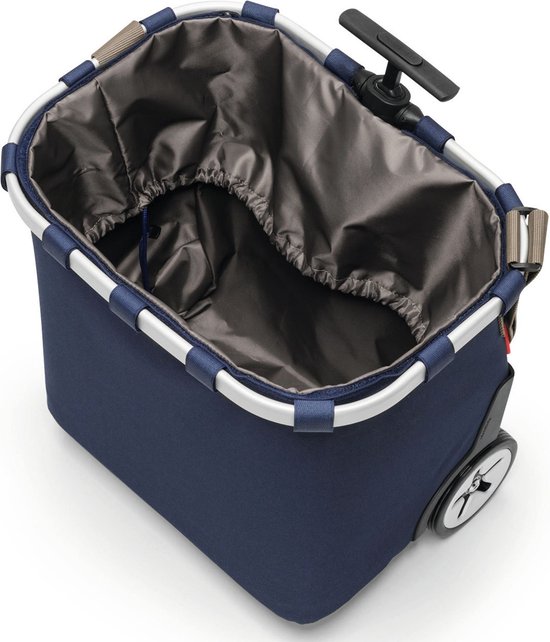 Binnenkant van een donkerblauwe boodschappentrolley met zilverkleurig frame en grijze binnenvoering met trekkoord.
