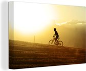 Le cycliste de montagne descend en VTT 120x80 cm - Tirage photo sur toile (Décoration murale salon / chambre)