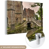 MuchoWow® Glasschilderij 30x20 cm - Schilderij acrylglas - Brug - Water - Delft - Foto op glas - Schilderijen