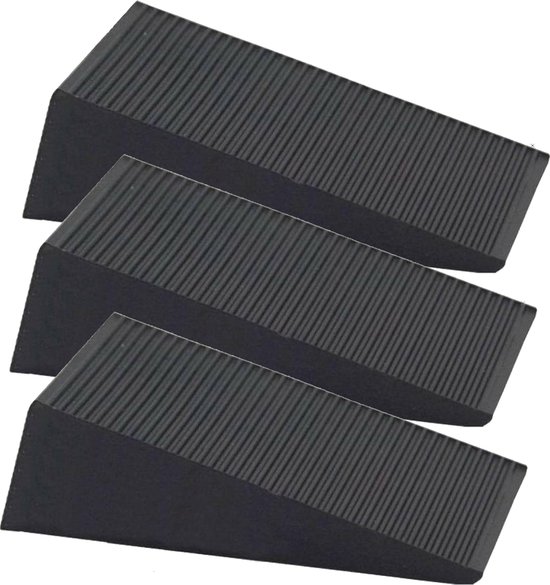 Drie zwarte rubberen deurstoppers met ribbels.