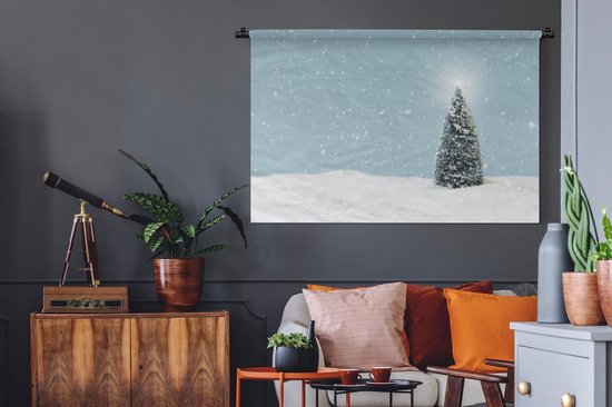 Tenture murale Noël - Un sapin de Noël dans un paysage enneigé et un ciel bleu Tenture murale coton 150x100 cm - Tapisserie murale avec photo